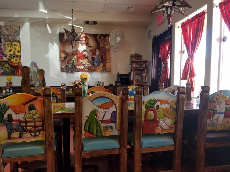 Casual dining room with simple tables and chairs.